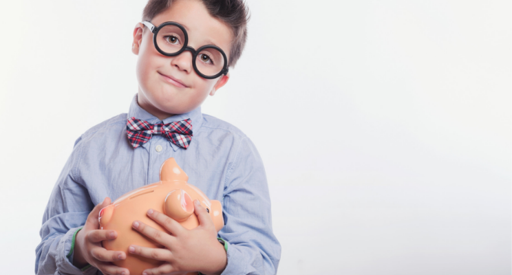 Child holding a piggy bank