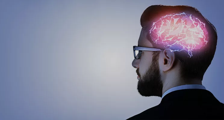 Man in glasses with a animated brain superimposed onto their head