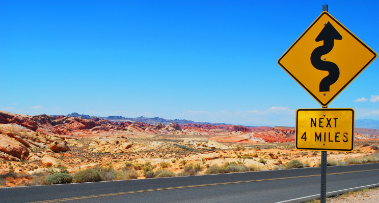 Desert with road sign