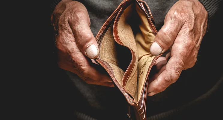 Person displaying an open faced empty wallet