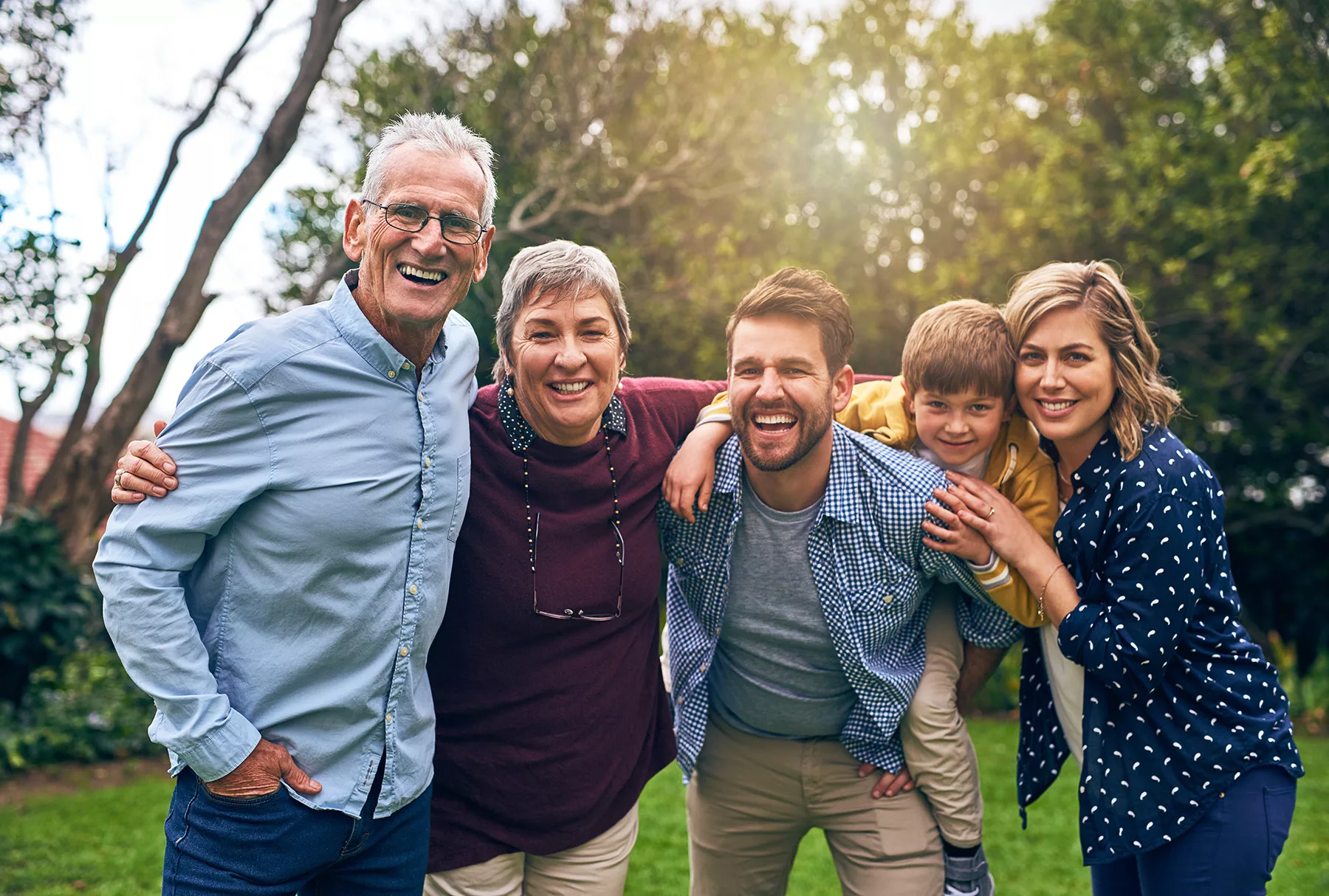 A stock image of 3 generations of a well-off family enjoying their time together for the investment philosophy page of Mainstream Capital management's website.